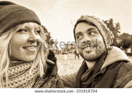 Young couple smiling outdoor - Happy friends facial expression for reconciliation - Closeup faces of young lovers - Concept of youth and human moods - Sunset light and black and white retro filter