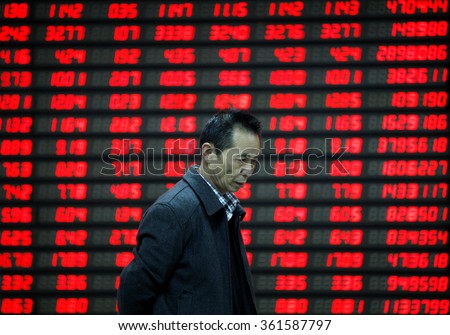 An investor watches electric board in a stock market in Huaibei, Anhui province, east China on 9th November 2015.