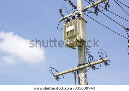Electricity transformer and power lines on concrete pole
