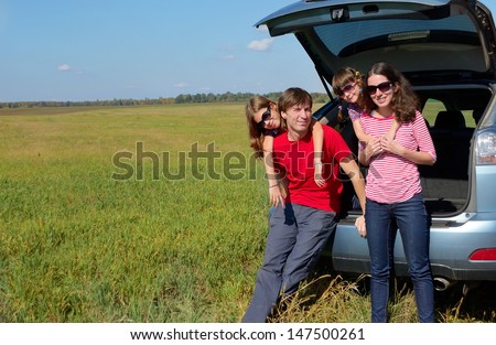 Family car trip on summer vacation, happy parents travel with kids and having fun. Car insurance concept