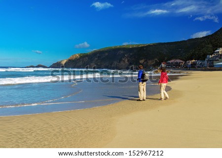 Happy couple on beautiful ocean beach, romantic vacation in South Africa