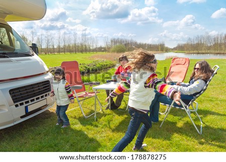 Family vacation, RV (camper) travel with kids, happy parents with children on holiday trip in motorhome