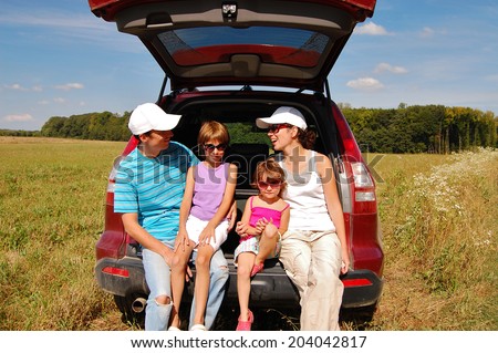 Family in car on vacation, happy parents and kids travel and have fun, car insurance concept
