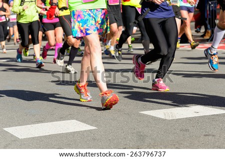 Marathon running race, people feet on road, woman run,  sport, fitness and healthy lifestyle concept
