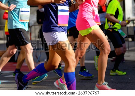 Marathon running race, people feet on road, women run,  sport, fitness and healthy lifestyle concept