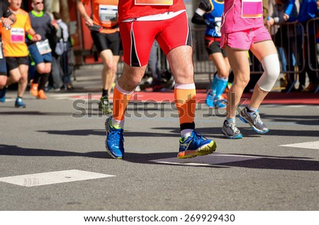 Marathon running race, runners feet on road, running with injury, sport, fitness and healthy lifestyle concept