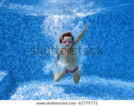 Underwater child, jump to the water in swimming pool