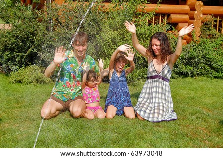 Happy family having fun in the garden