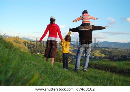 Family of four on their vacation in mountains