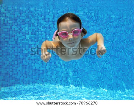 Child Swimming Underwater