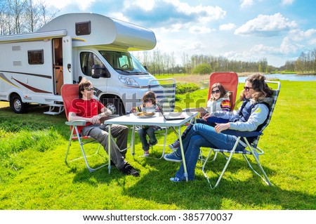 Family vacation, RV (camper) travel with kids, happy parents with children on holiday trip in motorhome