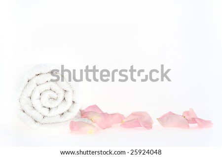 Elegant petals of rose with towels in a zen spa atmosphere