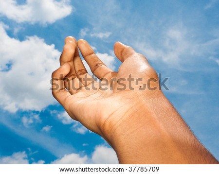 Hand reaching out to heaven for help