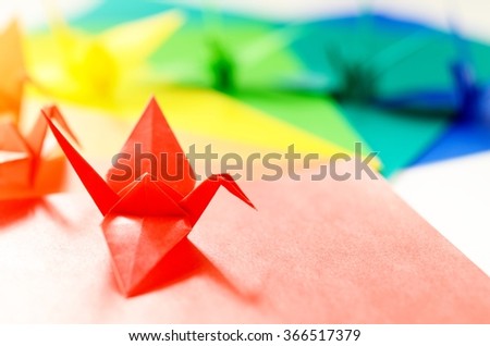 colorful origami birds on colorful papers