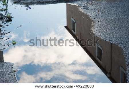 Building reflected in water