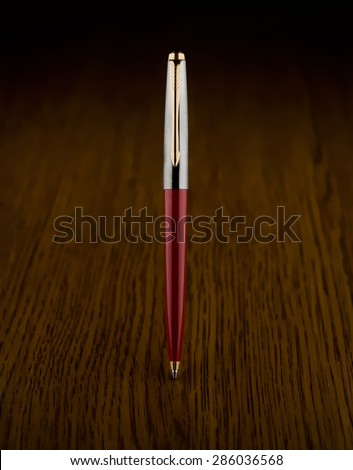 ball pen on wood table