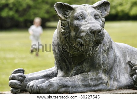 Stone statue of a lion, England