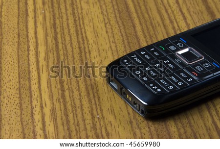 cell phone on a wooden background