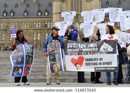 OTTAWA, CANADA  OCT 25:  Unidentified people gather hold a demonstration to demand a national plan to end violence against women on Parliament Hill Oct 25, 2012 in Ottawa, Ontario.