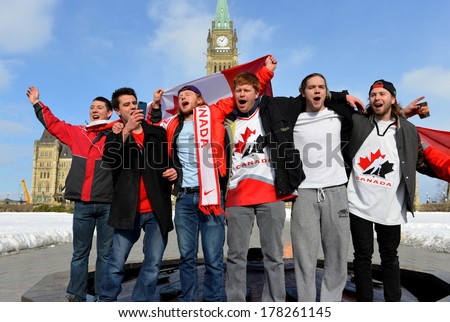 OTTAWA - FEB 23: Canadians sing national anthem to celebrate Canada\'s defense of Olympic hockey gold with 3-0 win over Sweden on Parliament Hill 10:06 am Feb 23, 2014 in Ottawa, Canada