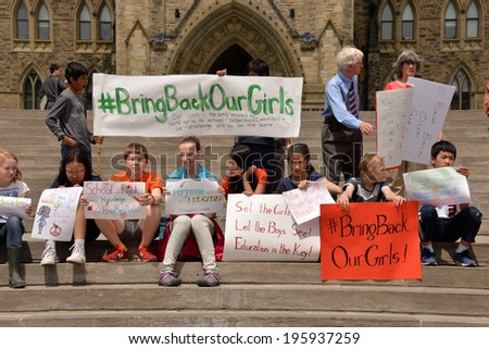 OTTAWA - MAY 22:  School children gather for a rally to activate governments to rescue the girls in Nigeria and protect school girls across the world on Parliament Hill  May 22, 2014 in Ottawa, Canada