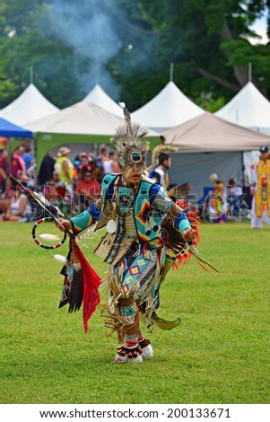 OTTAWA - JUN 21: Teenage boy performs traditional dance at Summer Solstice Aboriginal Arts Festival for Aboriginal Day in Massey Park June 21, 2014 in Ottawa, Canada