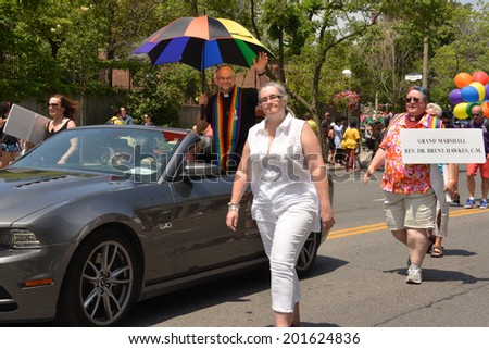 TORONTO, CANADA - JUN 29:  Gay rights activist Rev. Dr. Brent Hawkes rides in a car as Grand Marshall for the final WorldPride parade June 29, 2014 in Toronto, Ontario