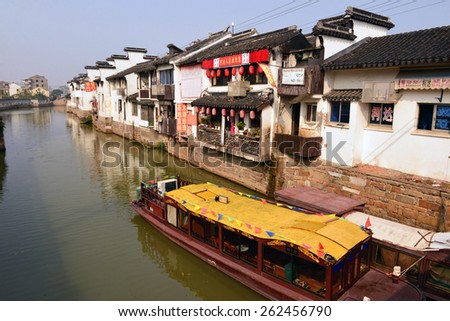 SUZHOU, CHINA - NOV 16, 2014: The ancient water town of Suzhou, China in Jiangsu province. It was founded in 514 B.C. and has been called the Venice of the East.