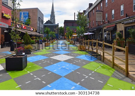 HALIFAX, CANADA AUG 3, 2015:  Argyle Street in Halifax, Nova Scotia, famous for its trendy bars and restaurants, with a new Argyle paint job on the section that has been closed to traffic.