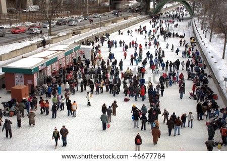 OTTAWA, CANADA – FEB 14: People celebrate the Winterlude Festival on the world’s largest outdoor skating rink on February 14, 2010 in Ottawa, Canada.