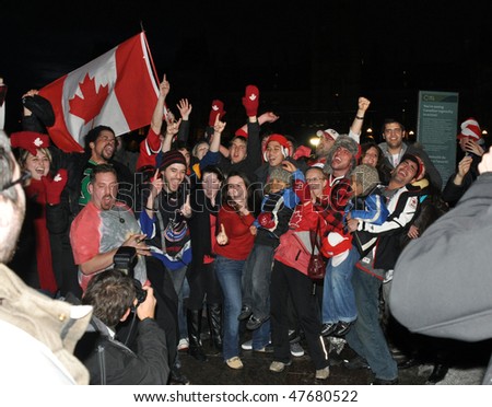 OTTAWA, CANADA - FEBRUARY 28:  Canadian fans celebrate the Canadian men's ice hockey gold medal win in the Winter Olympics.  February 28, 2010, Ottawa, Ontario