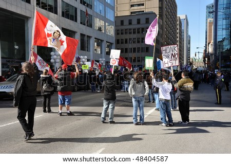 OTTAWA, CANADA - MARCH 10: Hundreds of Native Canadians gather in front of the Treasury Board building to protest the HST tax on First Nations peoples March 10, 2010 in Ottawa, Ontario.