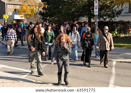 OTTAWA, CANADA - OCT 23:  Unidentified people dressed as zombies walk through Ottawa for the annual Zombie Walk, October 23, 2010 in Ottawa, Ontario.