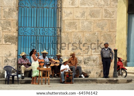 HAVANA - FEB 2:  Street musicians play music for tourists in Havana, Cuba Feb 2, 2010.  Tourism is now Cuba\'s main source of income and many Cubans depend on tips from tourists to boost their income.