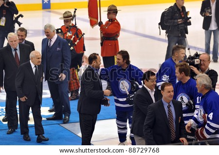 TORONTO, CANADA – NOV 13: Recent HHOF inductees are congratulated by other former NHL players at the Hockey Hall of Fame Legends Classic game on Nov 13, 2011 in Toronto, Canada.