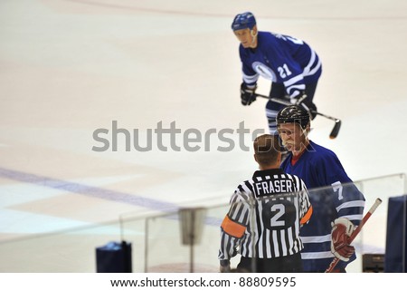 TORONTO, CANADA - NOV 13:  Lanny McDonald is interviewed by Kerry Fraser as Salming watches during the Hockey Hall of Fame Legends Classic game played at the Air Canada Centre on Nov 13, 2011 in Toronto, Canada