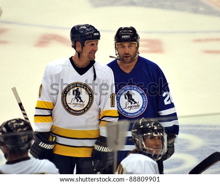 TORONTO, CANADA – NOV 13:  Gary Roberts (L) chats with new inductee Ed Belfour at the Hockey Hall of Fame Legends Classic game on Nov 13, 2011 at the Air Canada Centre in Toronto, Canada.