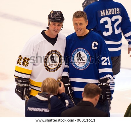 TORONTO, CANADA - NOV 13:  New inductee Joe Nieuwendyk (L)  poses with team captain Borje Salming after the Hockey Hall of Fame Legends Classic game on Nov 13, 2011 at the Air Canada Centre in Toronto, Canada.