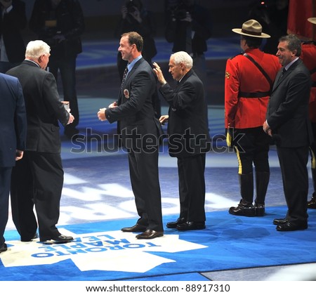 TORONTO, CANADA - NOV 13:  Joe Nieuwendyk is given his Hall of Fame blazer before the Hockey Hall of Fame Legends Classic game on Nov 13, 2011 Air Canada Centre in Toronto, Canada.