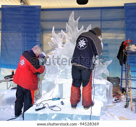OTTAWA, CANADA - FEB 4: Ice sculptors at work during the Winterlude Festival on February 4, 2012 in Ottawa, Ontario, Canada.