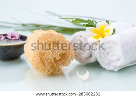 Spa concept with Floating Flowers, Loofah and Flower on towels