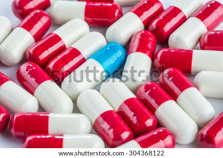 blue capsules and red capsules, illness medication cure pharmaceutical close up