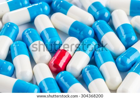 blue capsules and red capsules, illness medication cure pharmaceutical close up