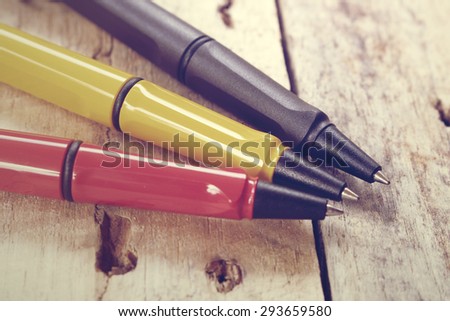 Vintage  pen on wooden background