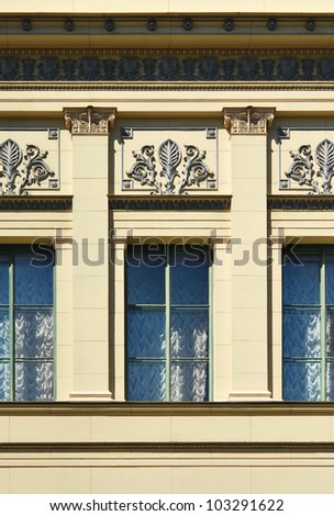 Classic palace windows decorated with fine relief details