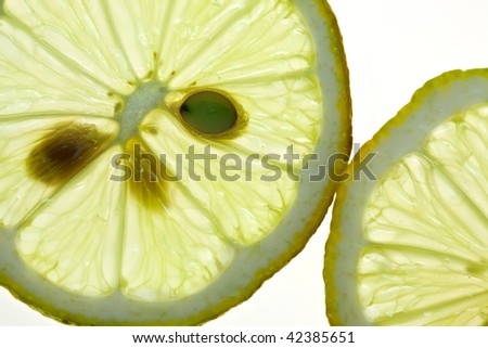 Sliced Lemon isolated on white with backlight