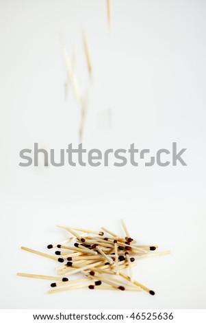 Pile of Matches, with matches falling down, white background