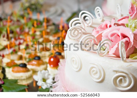 banquet with a cake decorated with cream flower