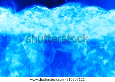 Studio photography of bubbles boiling water in an electric kettle
