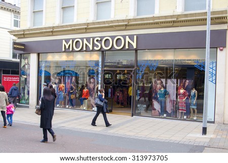 LEEDS, UK - 5 SEPTEMBER 2015. Monsoon Shop in Leeds. People walking in front of the large Monsoon clothing store on a busy shopping day in Leeds